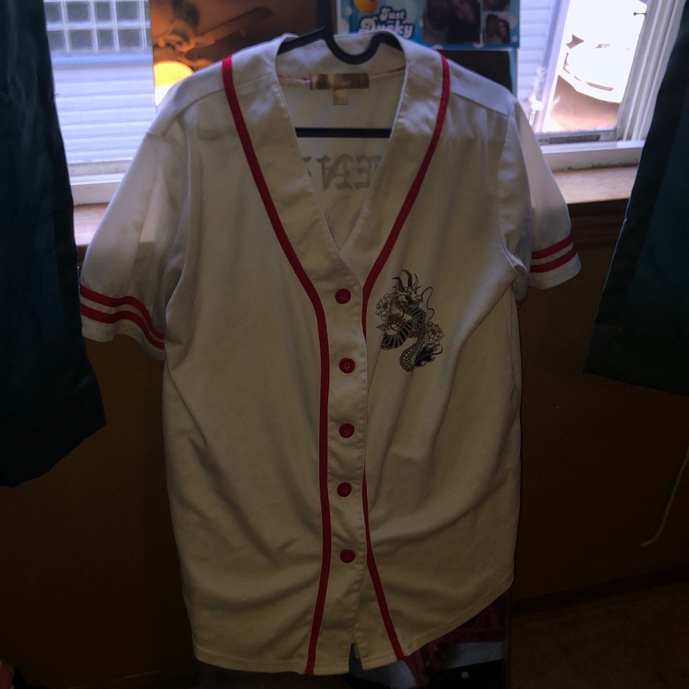 White jersey A couple of brown stains but could be fixed with bleach.